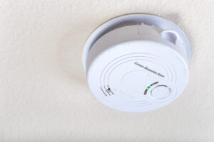 Close up of a ceiling mounted carbon monoxide dectector.